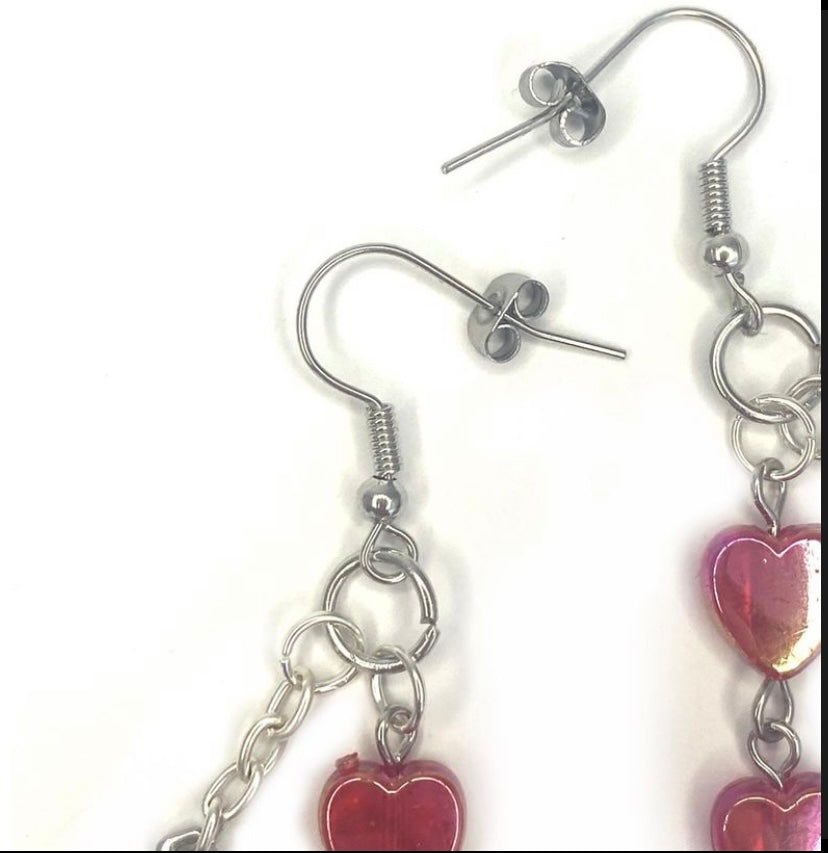 Earrings with red hearts and a chrome cross charm